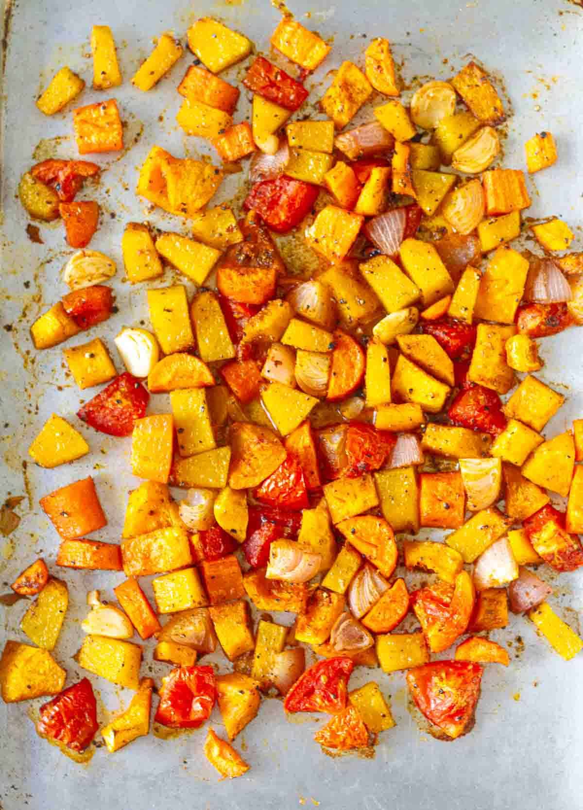 roasted vegetables on a baking tray.