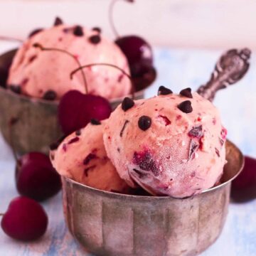 cherry frozen yogurt scoops in 2 bowls.