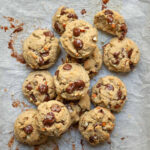 Chocolate chip cookies on parchment paper.