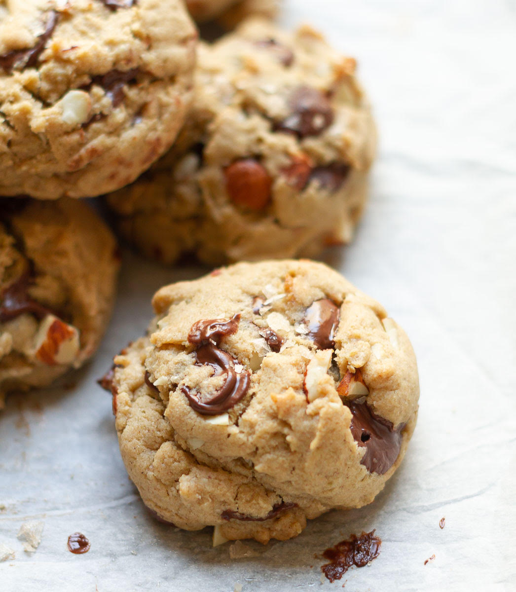 Chocolate chip cookie on parchment paper.