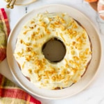 Pumpkin Swirl Cake with Cream Cheese Frosting on a serving platter.