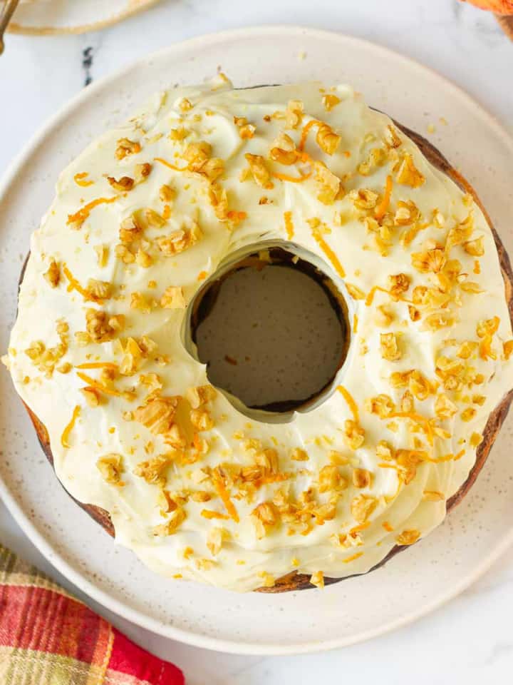 Pumpkin Swirl Cake with Cream Cheese Frosting on a serving platter.