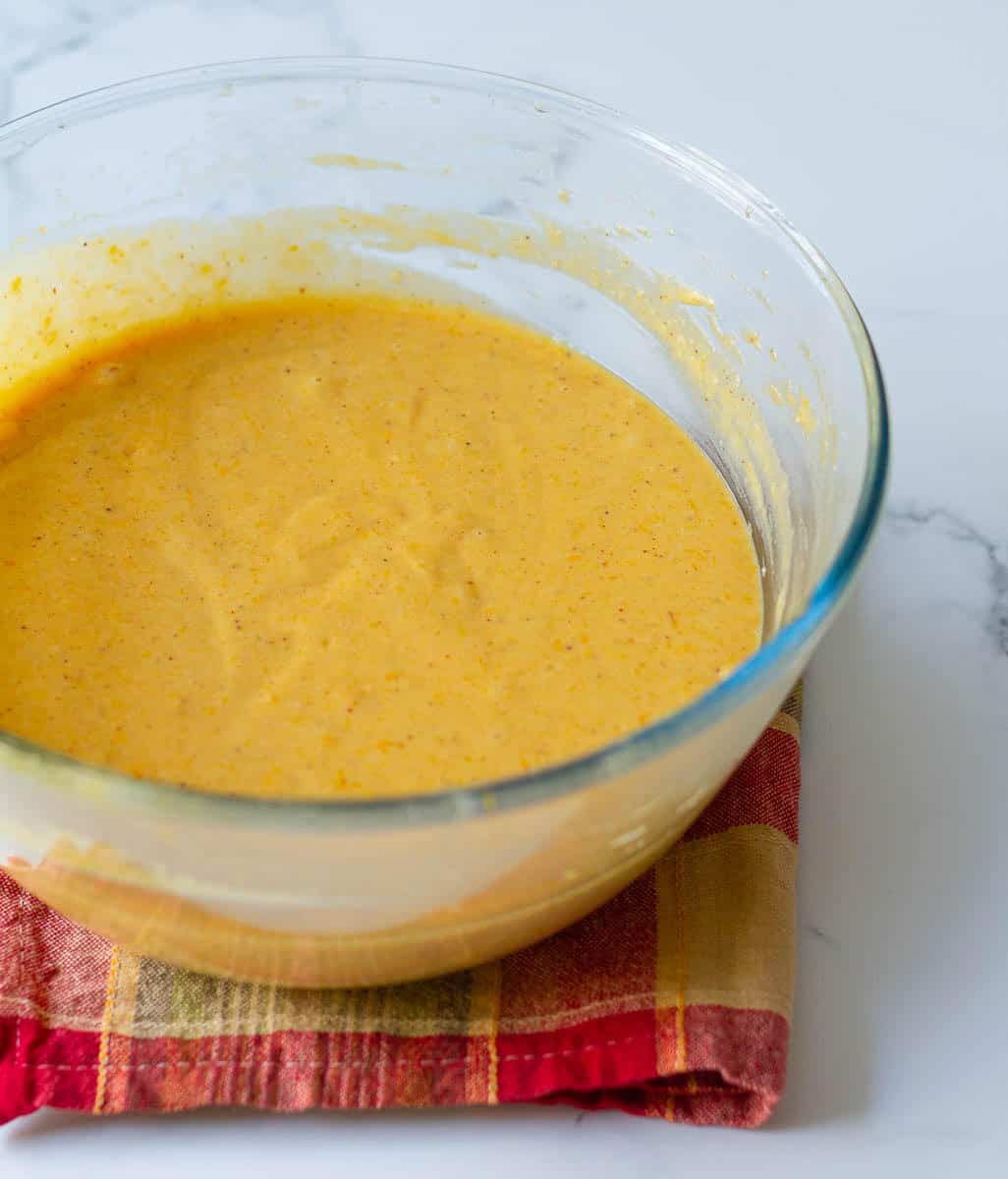 pumpkin cake batter in a glass bowl