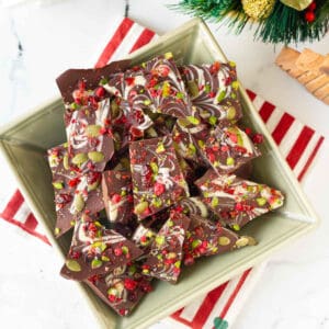 chocolate bark cut into pieces placed in a green bowl.