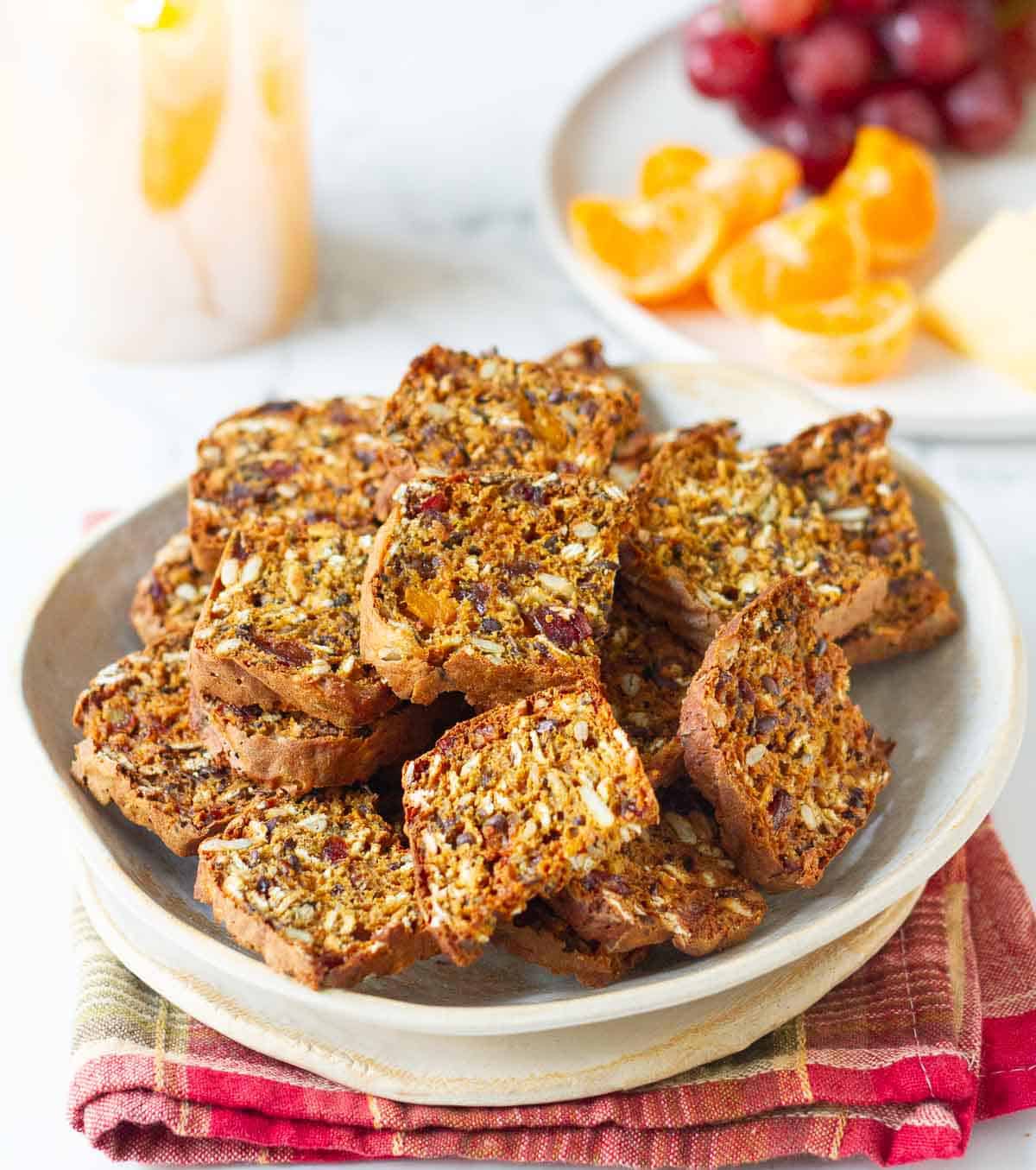 pumpkin crisps in a bowl on a plaid napkin with ingredients in the background.