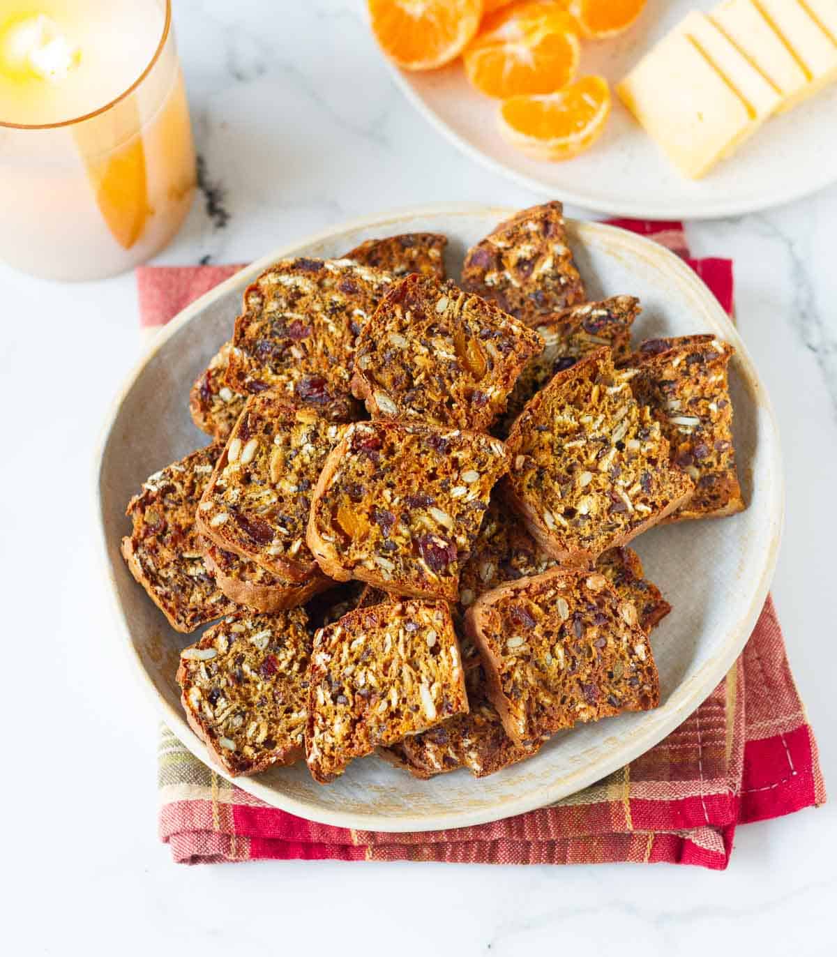 pumpkin crackers on a plate with ingredients in the background.