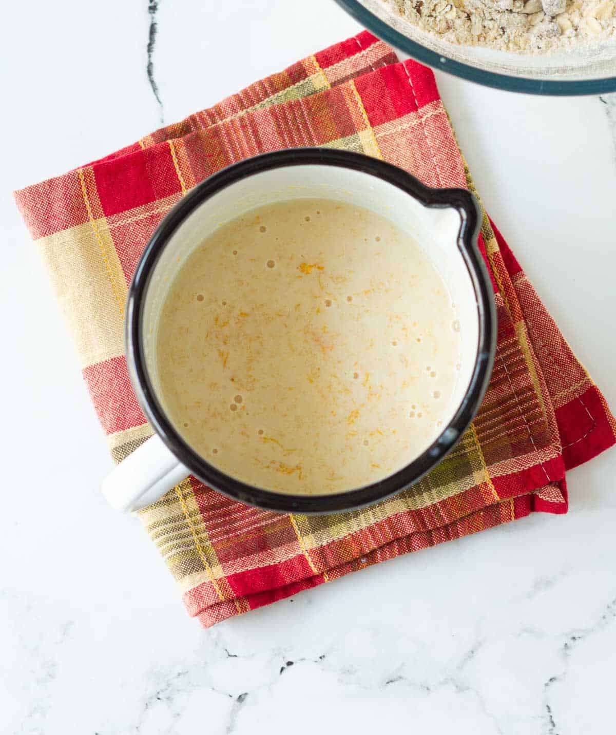 buttermilk, pumpkin puree and brown sugar combined in a cup.