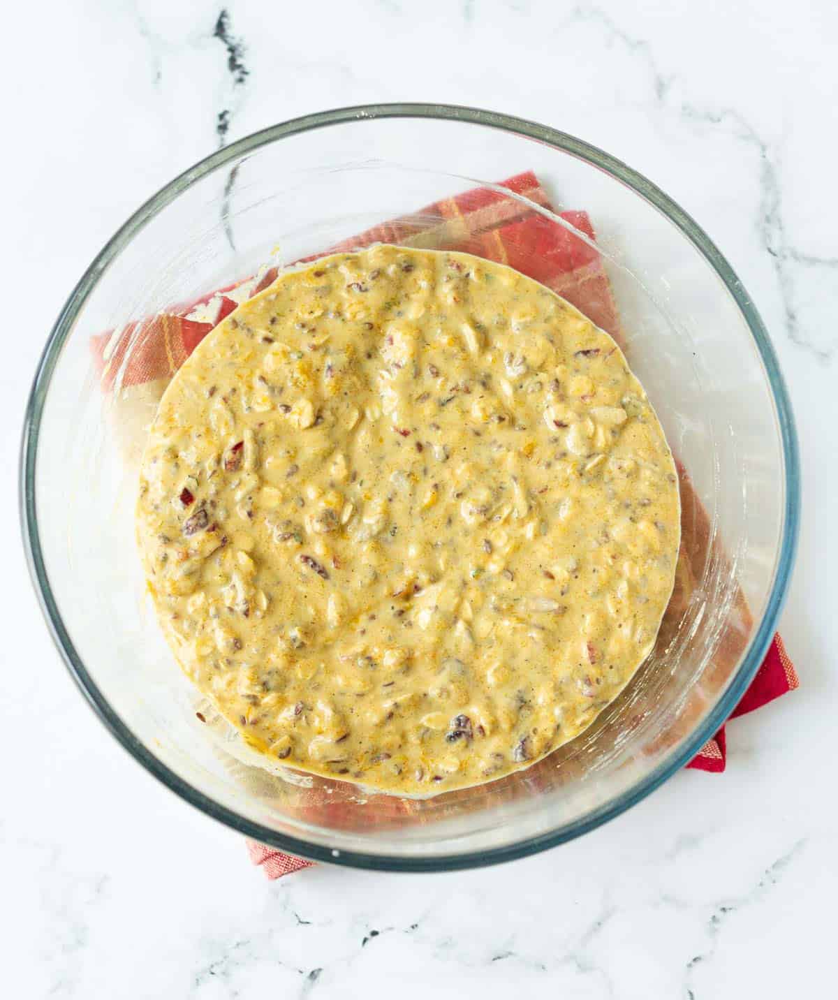 batter for pumpkin crackers in a glass mixing bowl.