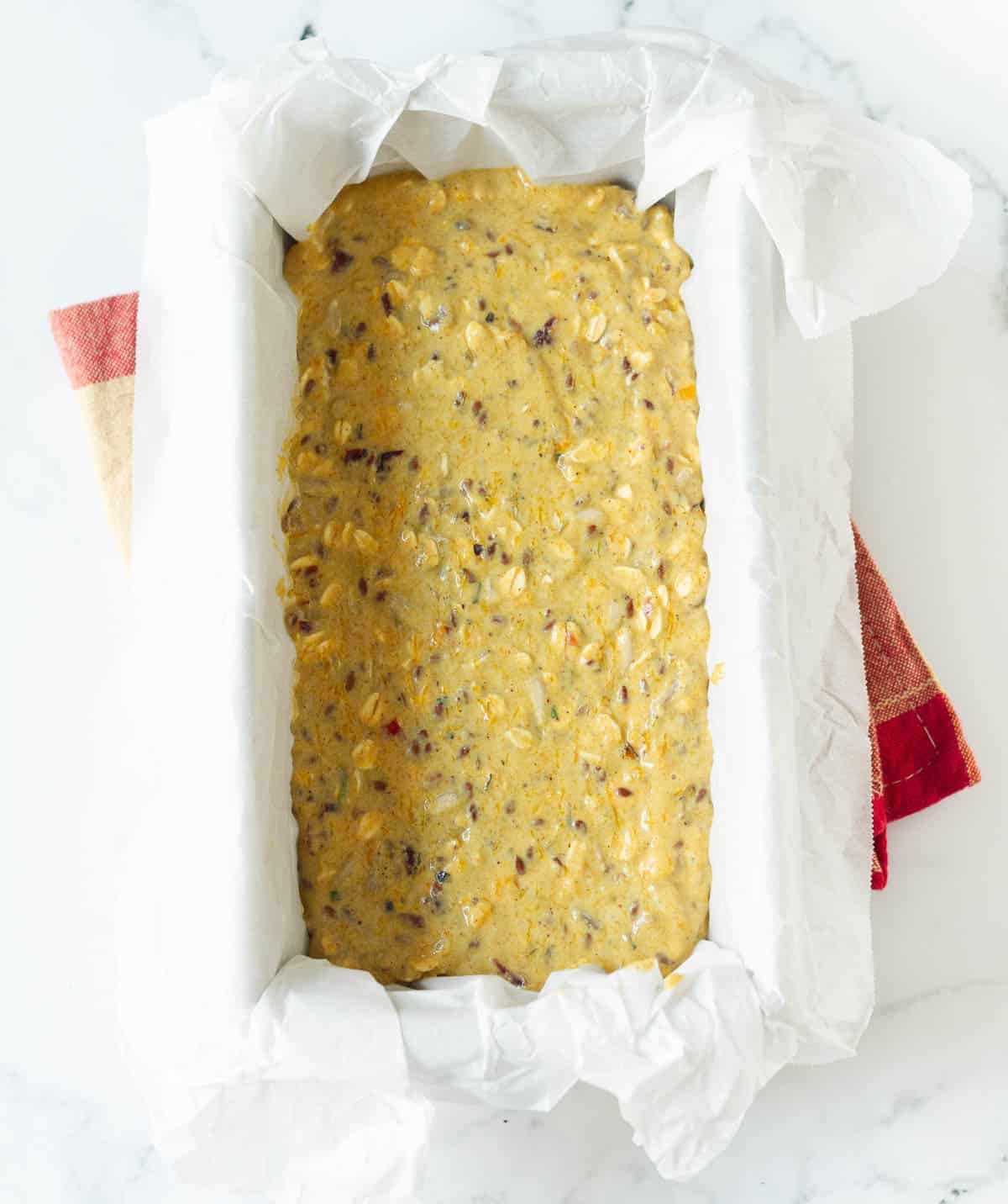 cracker's batter in a parchment-lined loaf pan.