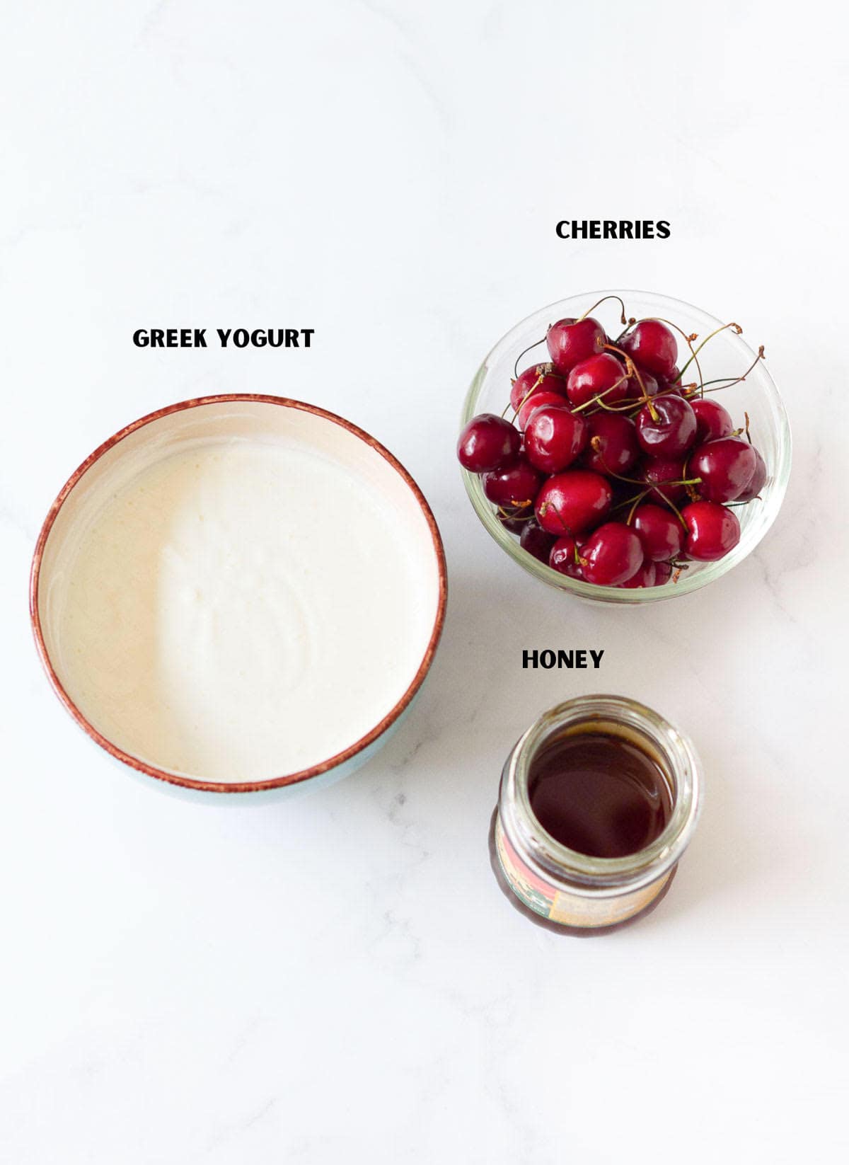 Ingredients for making cherry popsicles.