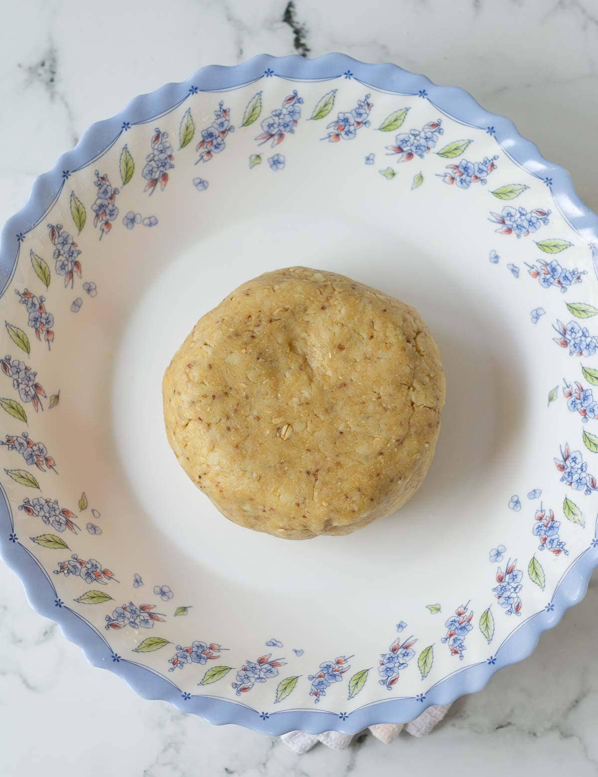 Dough for crackers in a bowl.