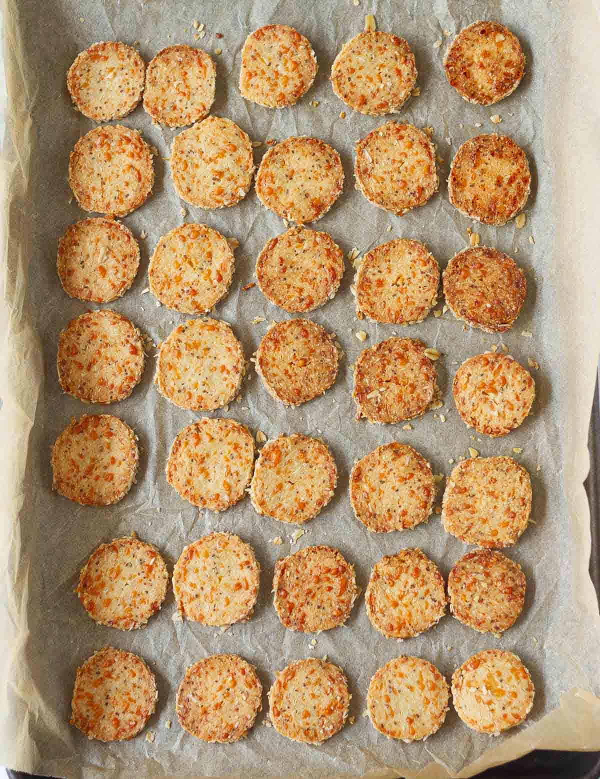 Baked crackers on parchment paper.
