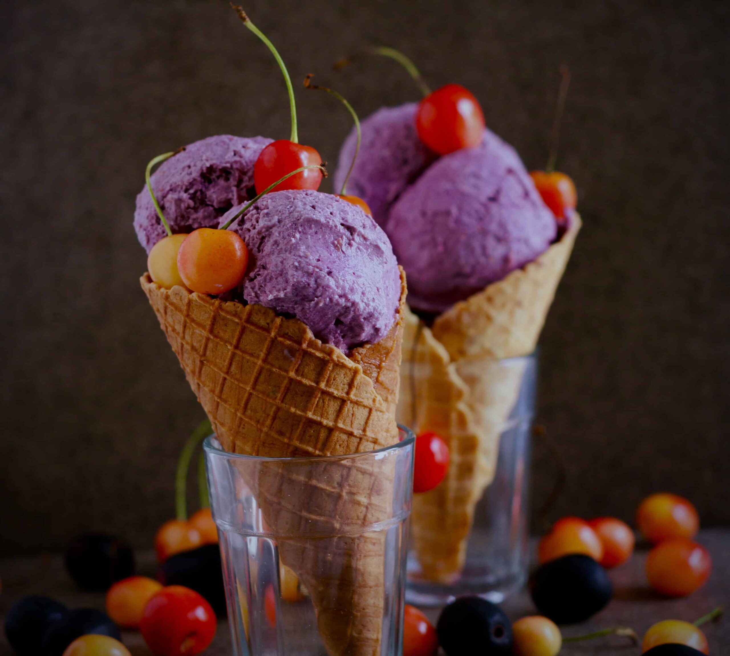 jamun icecream in 2 waffle cones placed in 2 glasses.