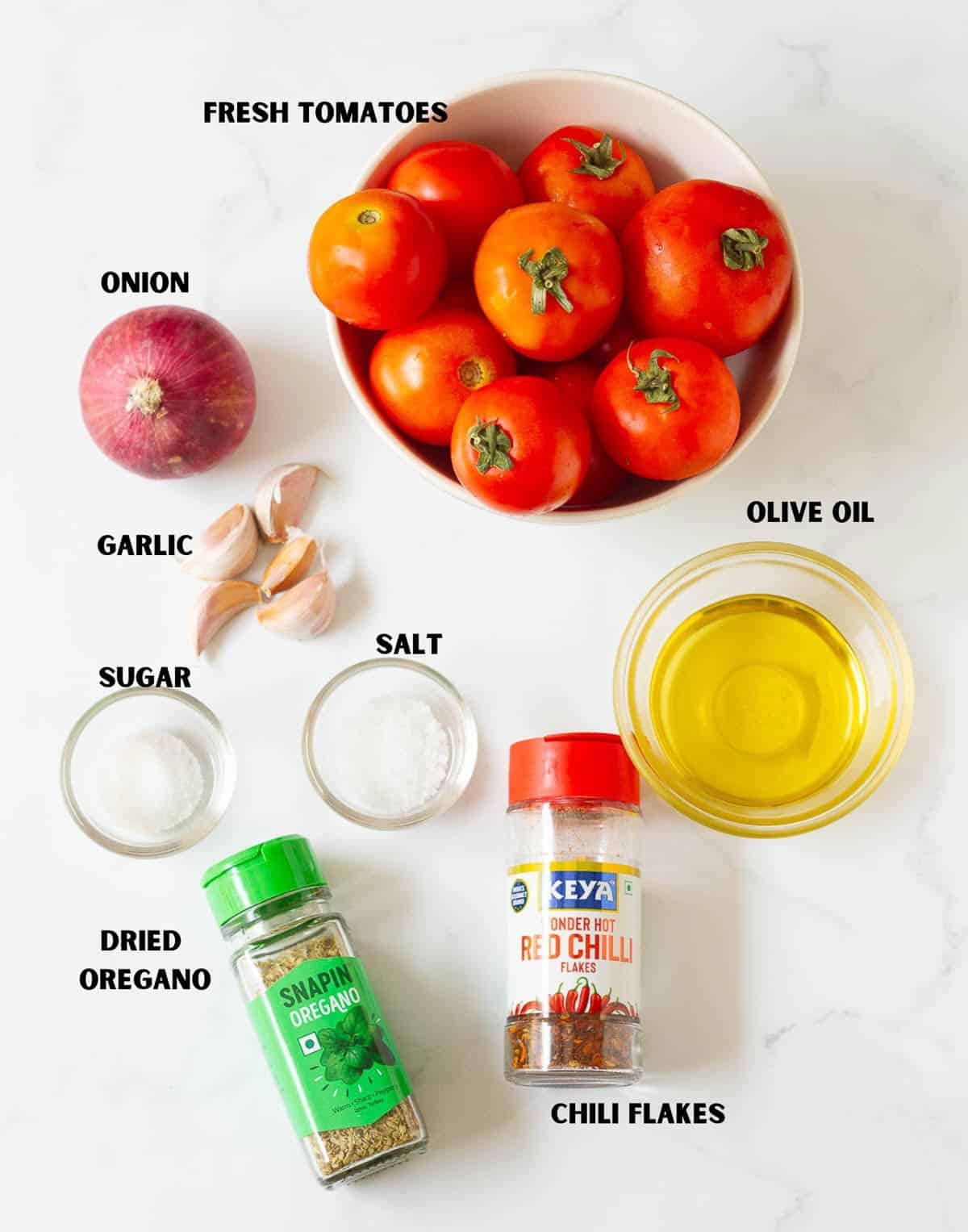 labelled ingredients for making homemade tomato sauce.
