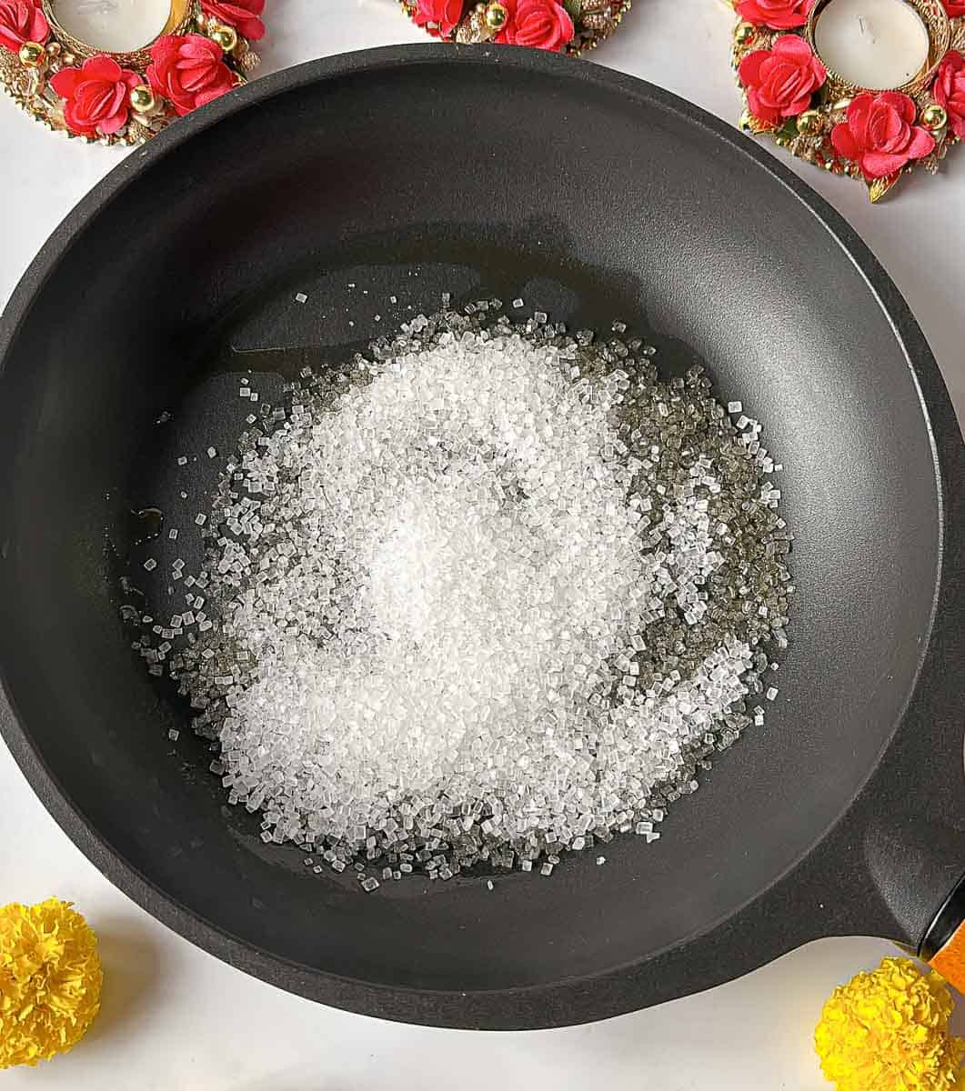 Add sugar to the pan