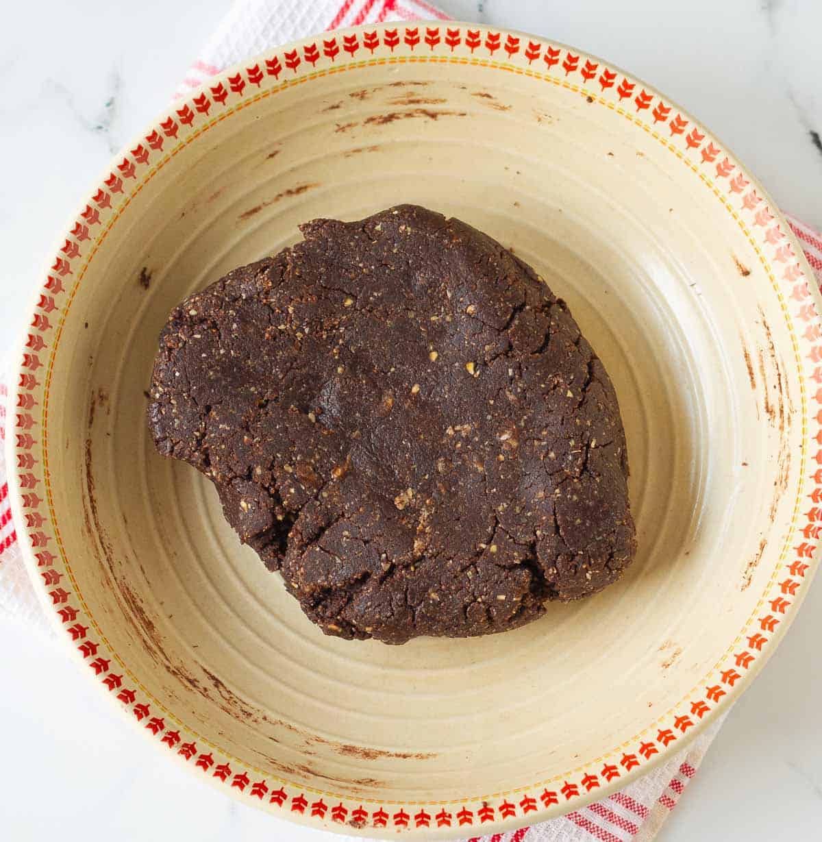 Dough for the energy balls in a mixing bowl.