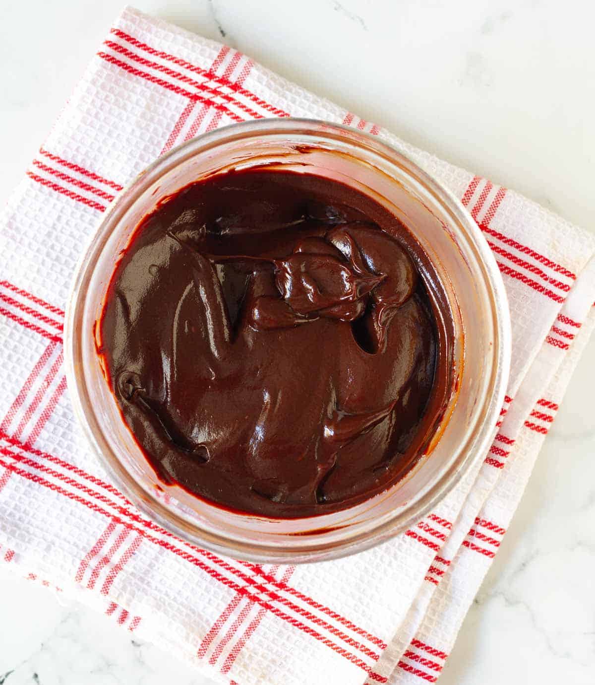 melted chocolate and cream mixture in a mixing bowl.