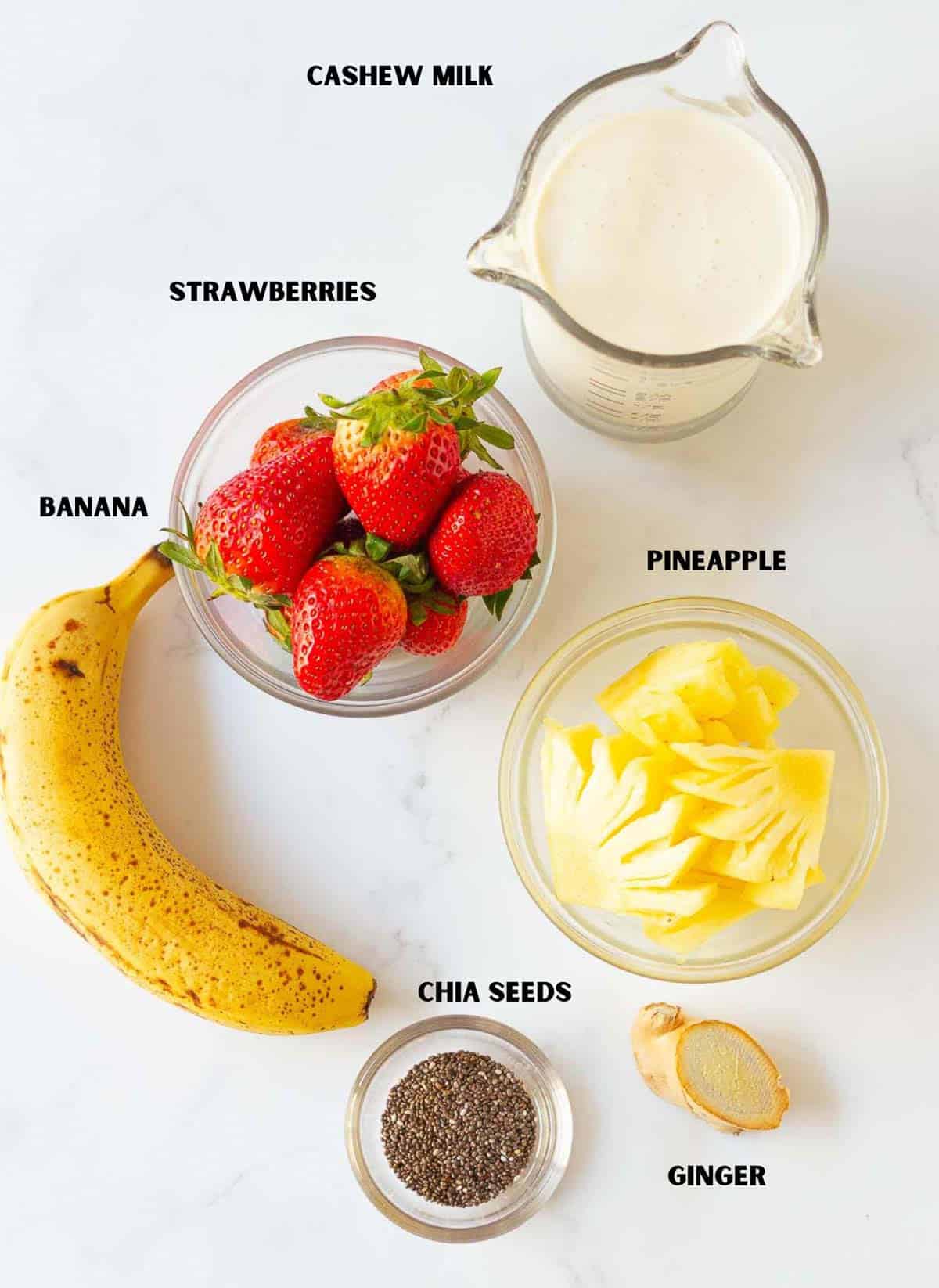 Ingredients for making pineapple strawberry smoothie.