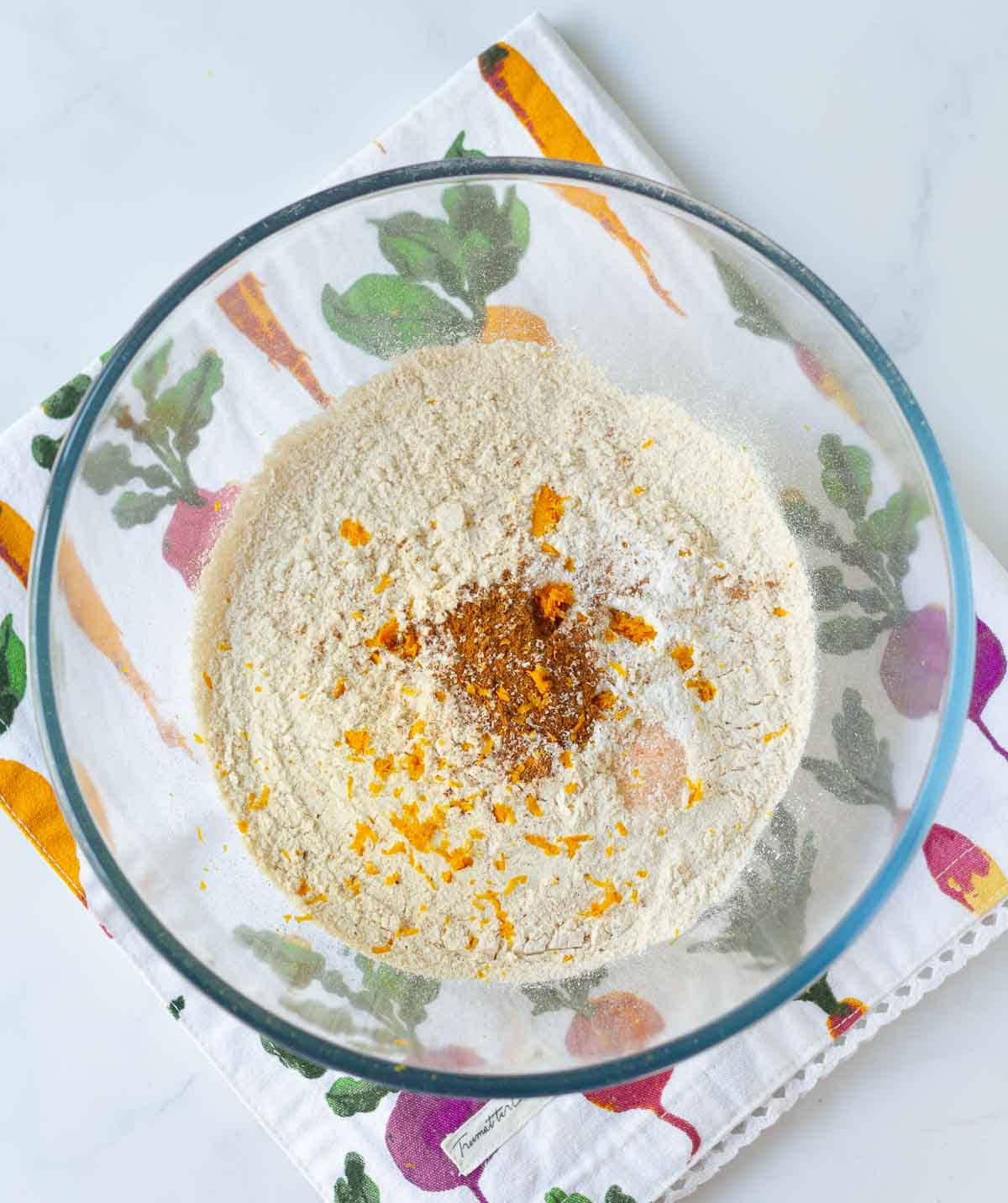 Dry ingredients for carrot cake in a mixing bowl.