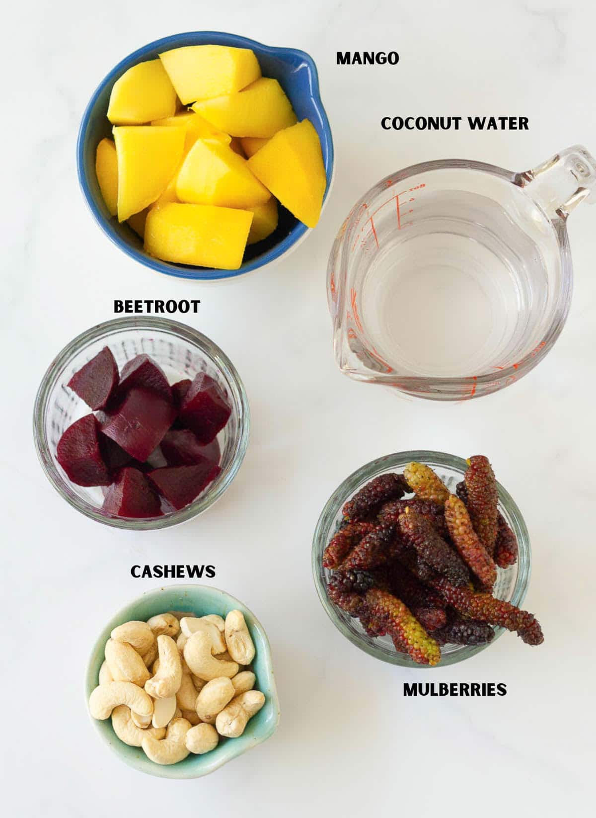 Ingredients for making mango mulberry smoothie.