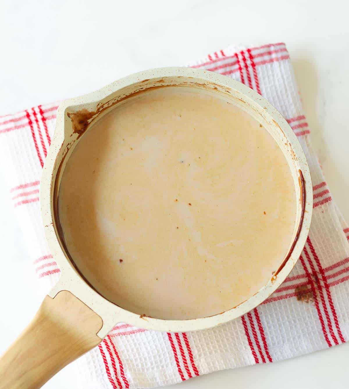 Milk and vanilla extract added to the chocolate cream mixture.