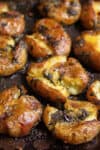 Baked potatoes on a tray.