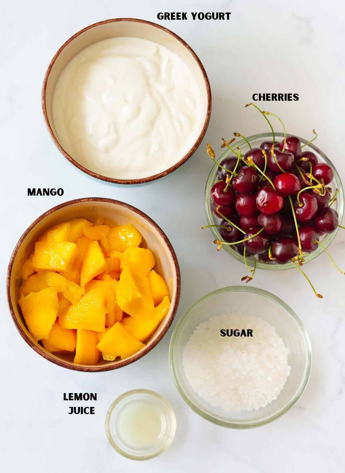 Ingredients for making mango frozen yogurt.