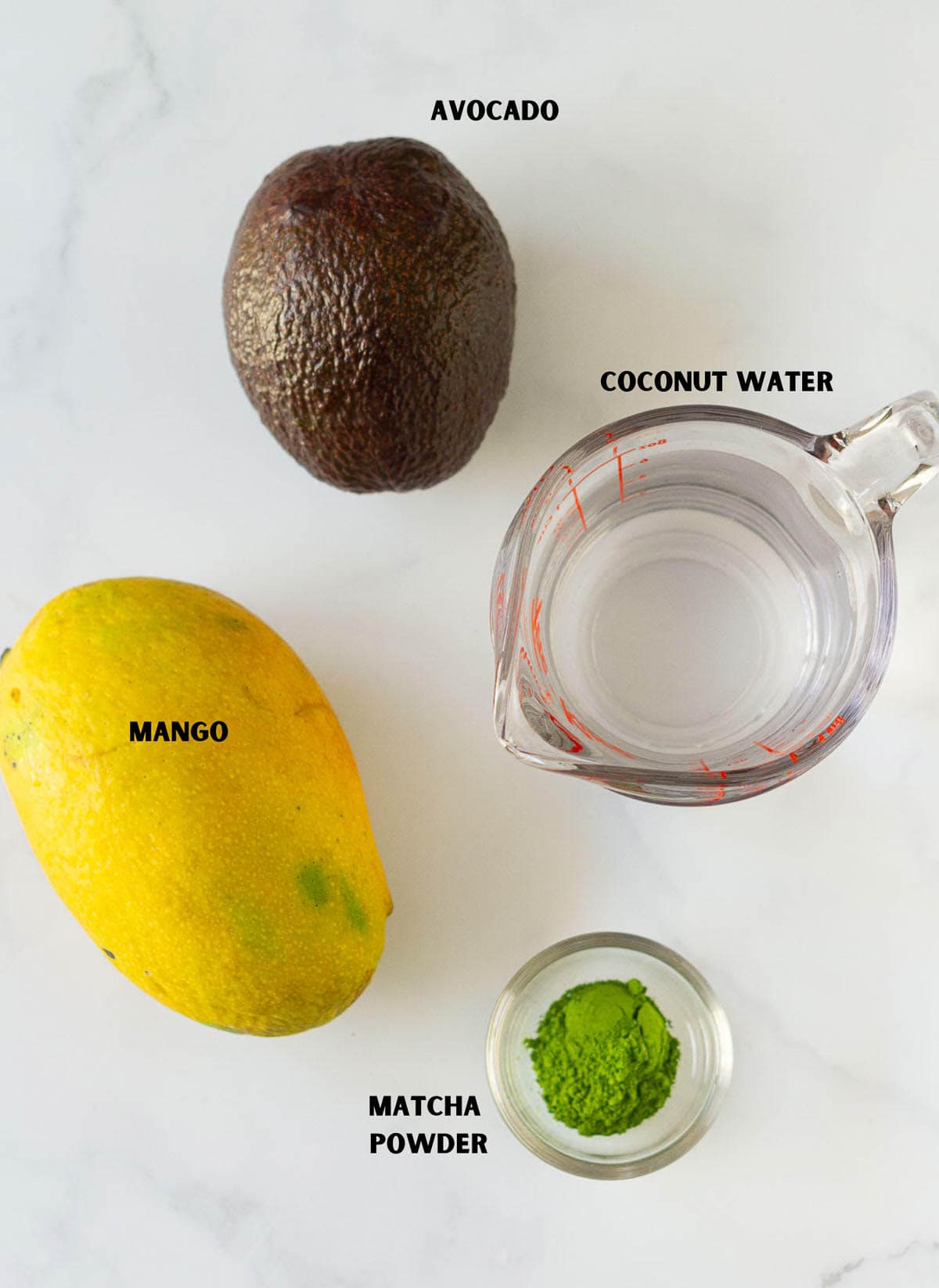 Ingredients for making mango matcha smoothie.