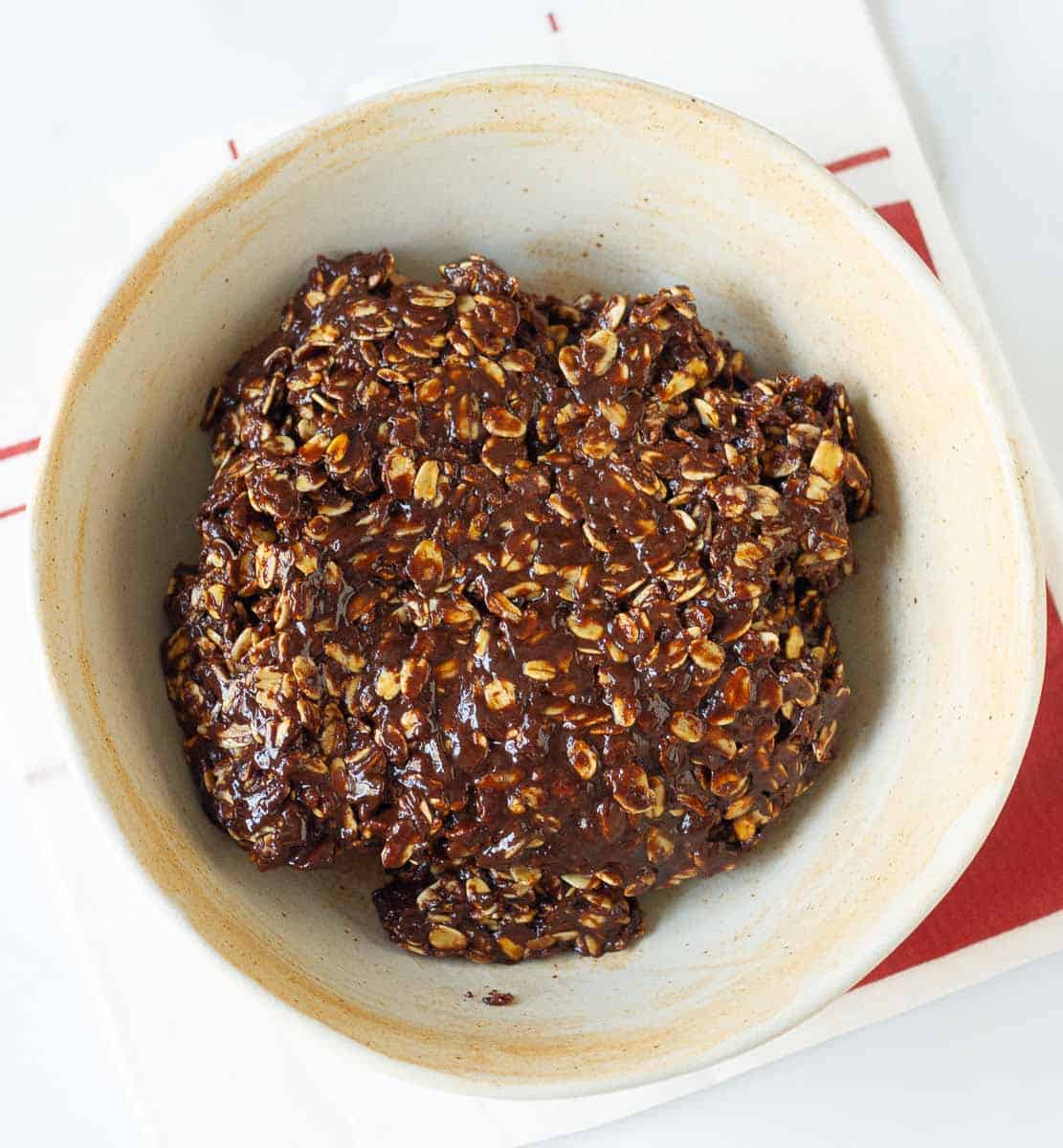 Dough for no-bake peanut butter chocolate cookies in a bowl.