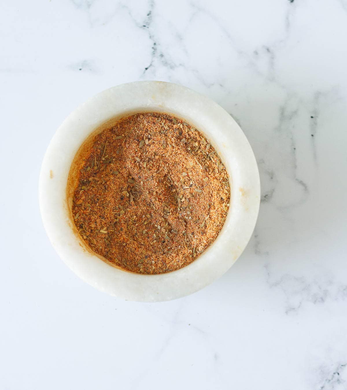 Mixed spices in a white bowl.