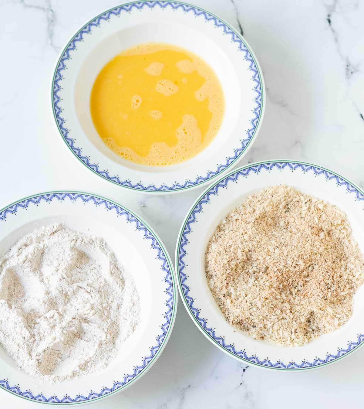 flour, breadcrumbs and eggs in 3 bowls.