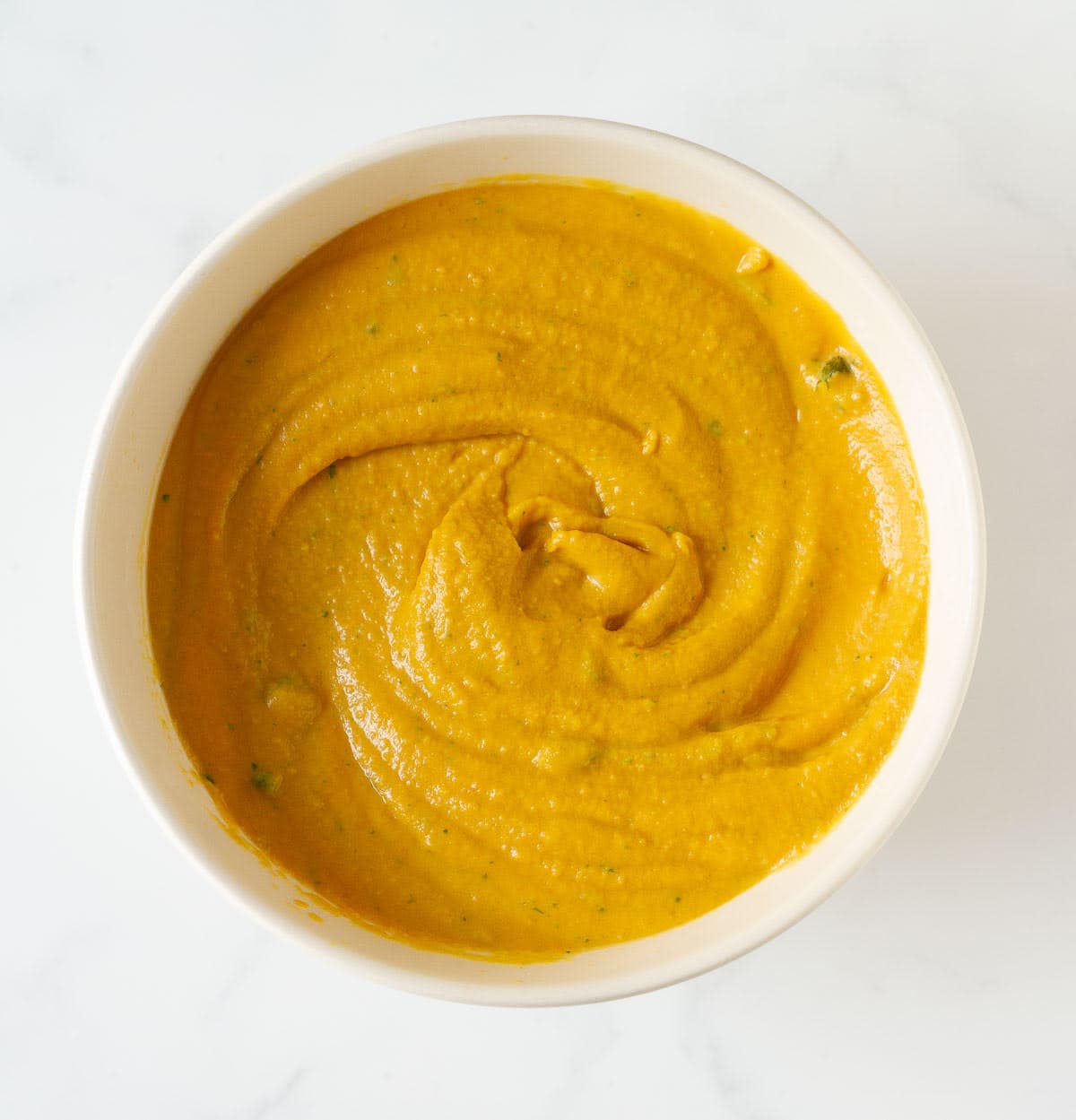 Carrot hummus in a bowl.