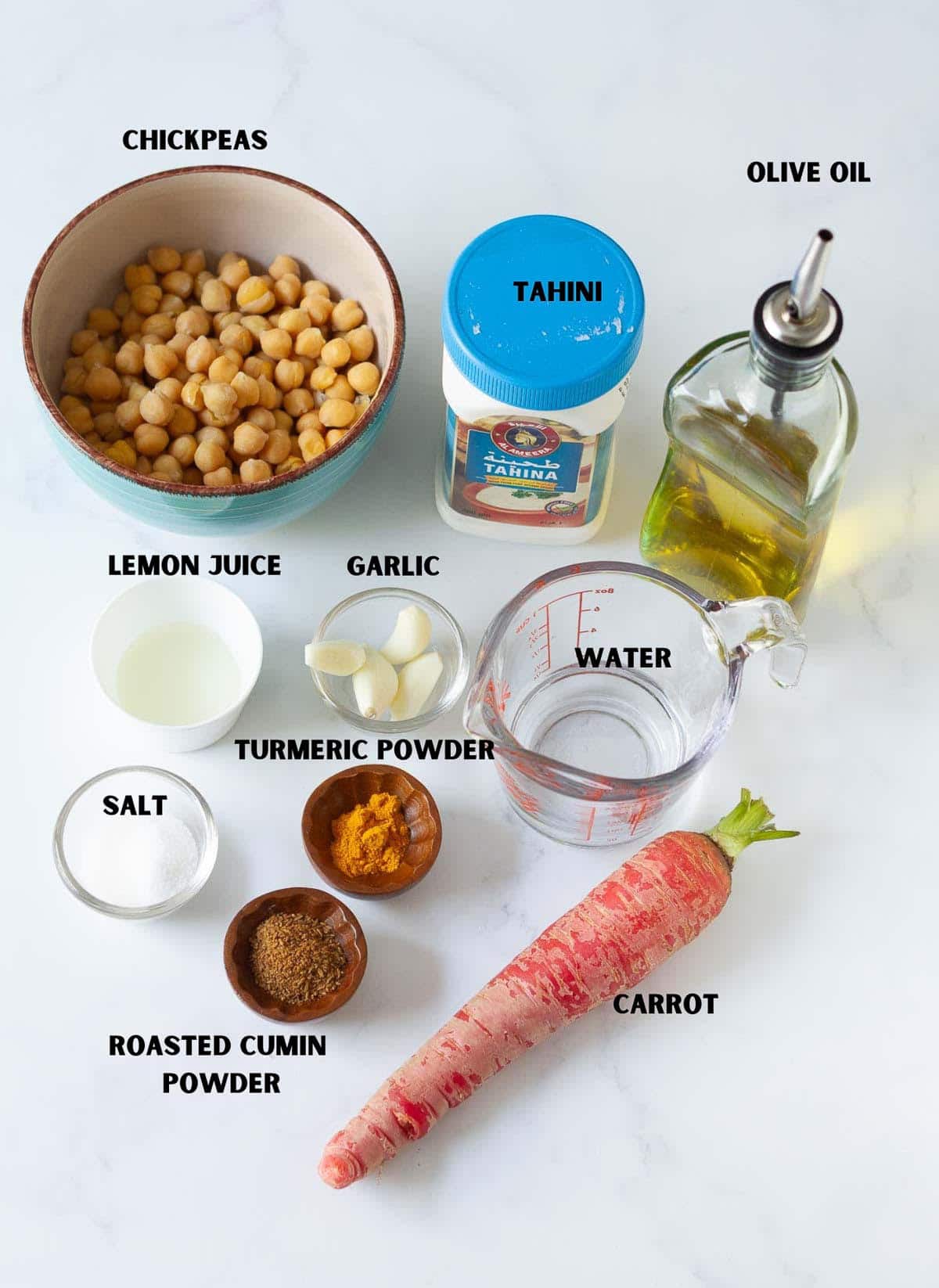Labelled ingredients for making roasted carrot hummus.