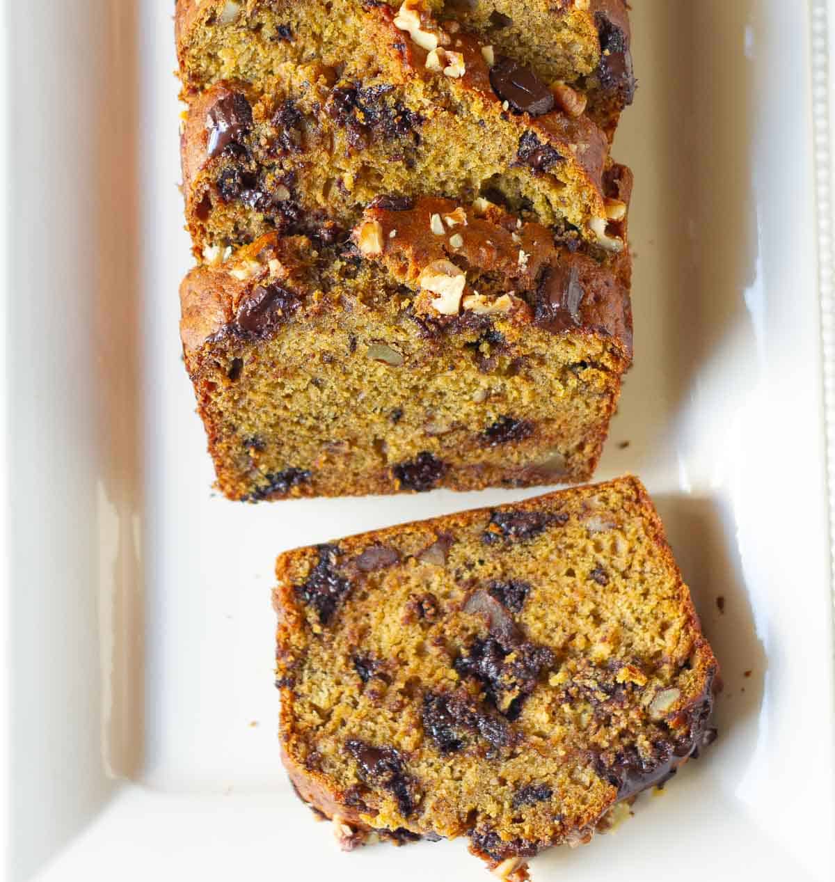 Sliced pumpkin banana bread on a platter.