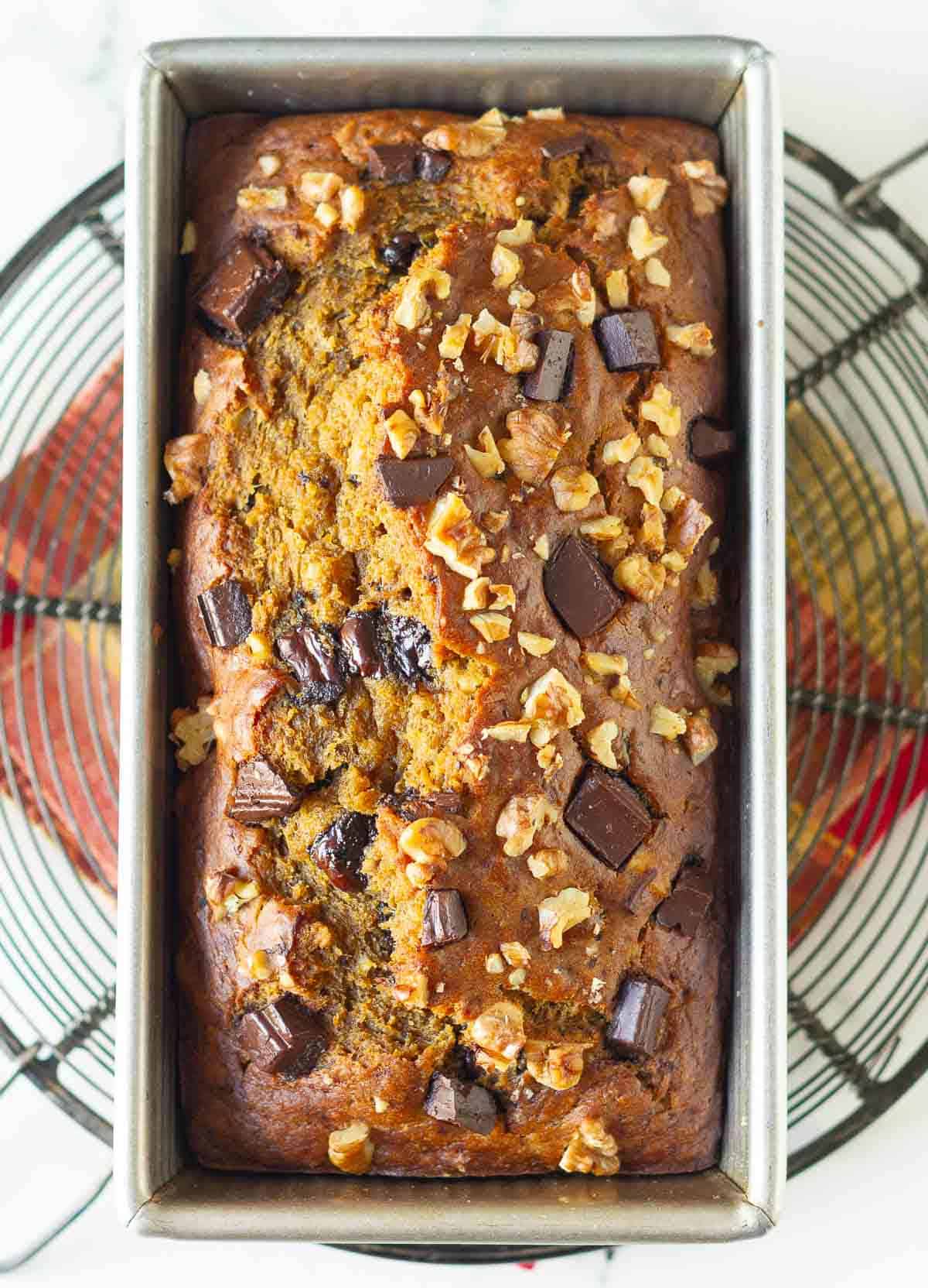 baked pumpkin banana bread in a cake pan.