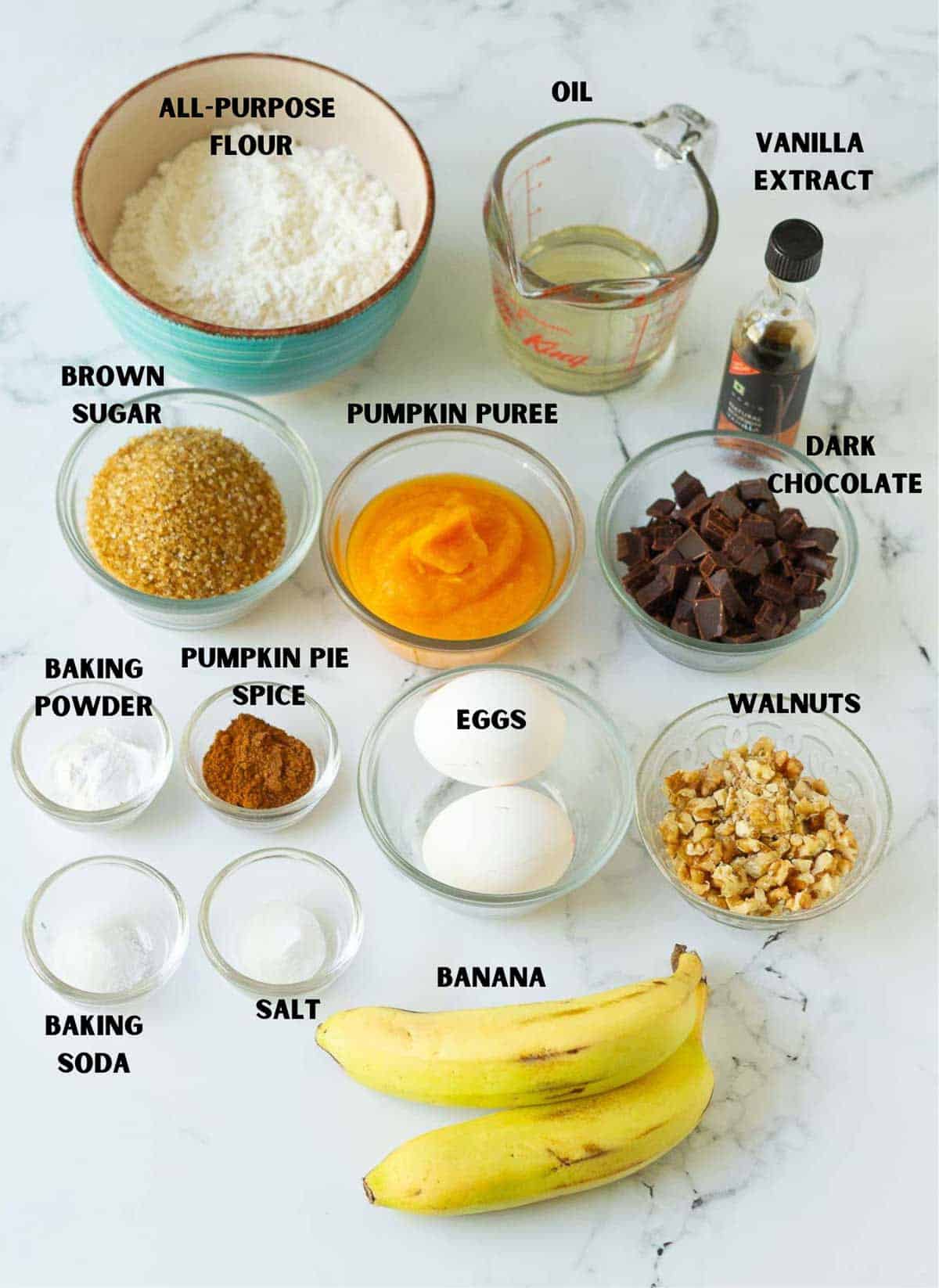 Labelled ingredients for making pumpkin banana bread.