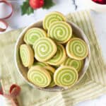 matcha pinwheel cookies in a bowl on a green napkin.