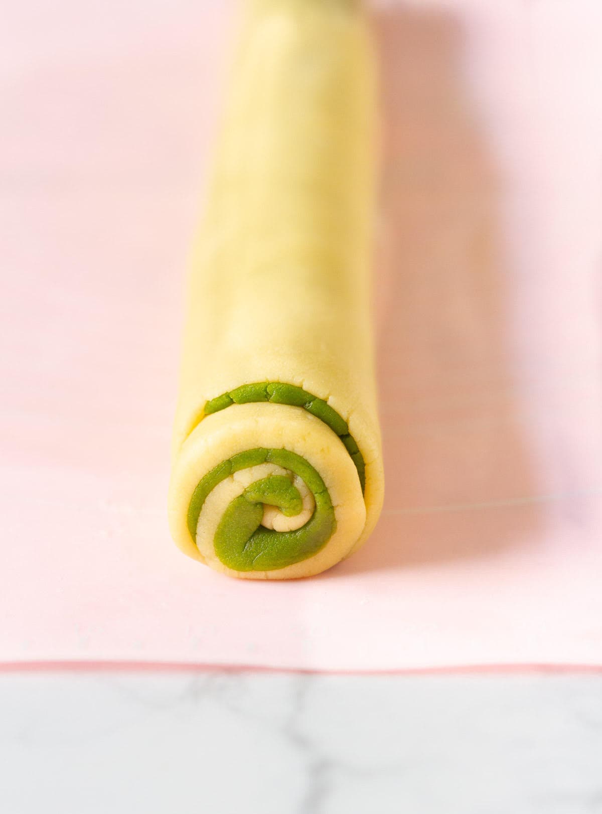 Rolled up cookie dough rectangles in a log.