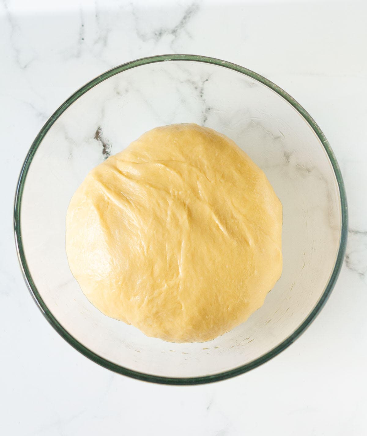 dough for chocolate babka in a glass mixing bowl.