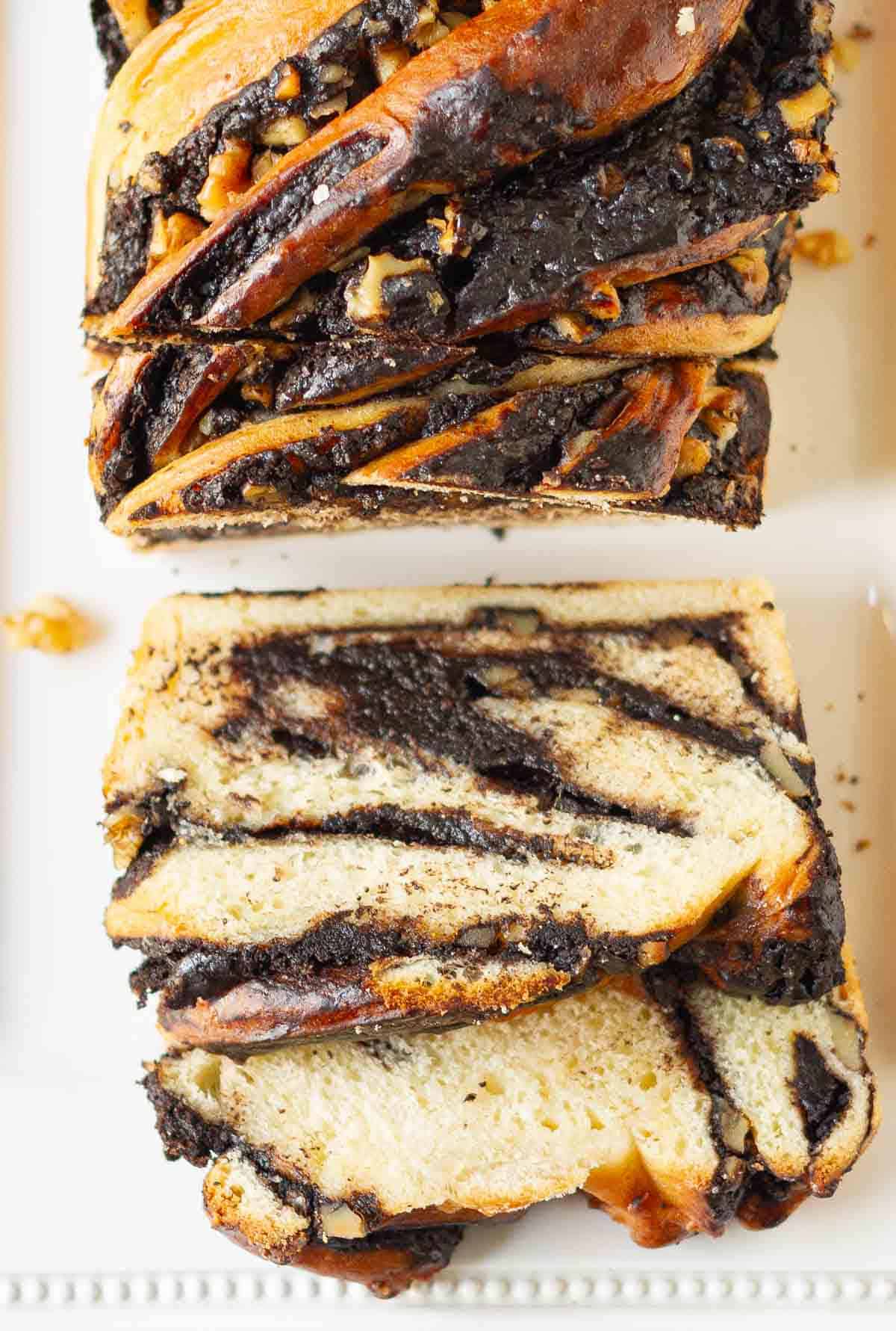 sliced babka on a white platter.