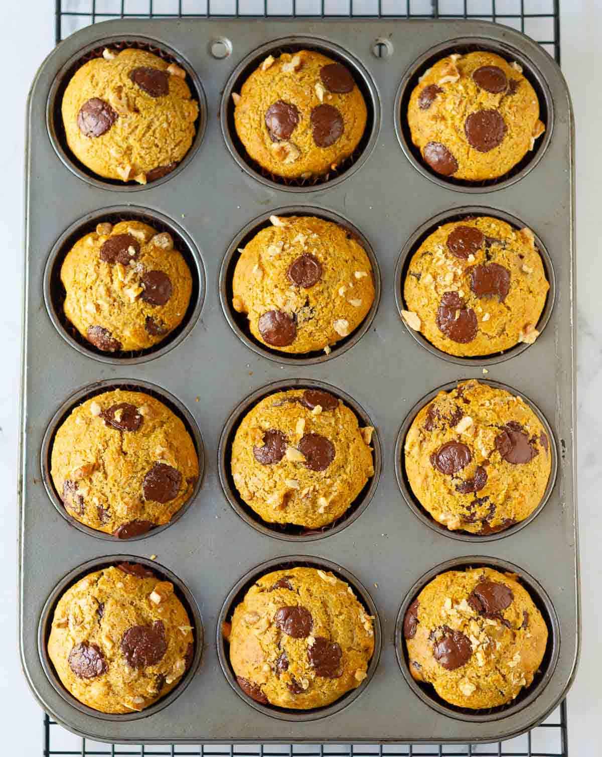 Baked muffins in a 12-cup muffin tray.