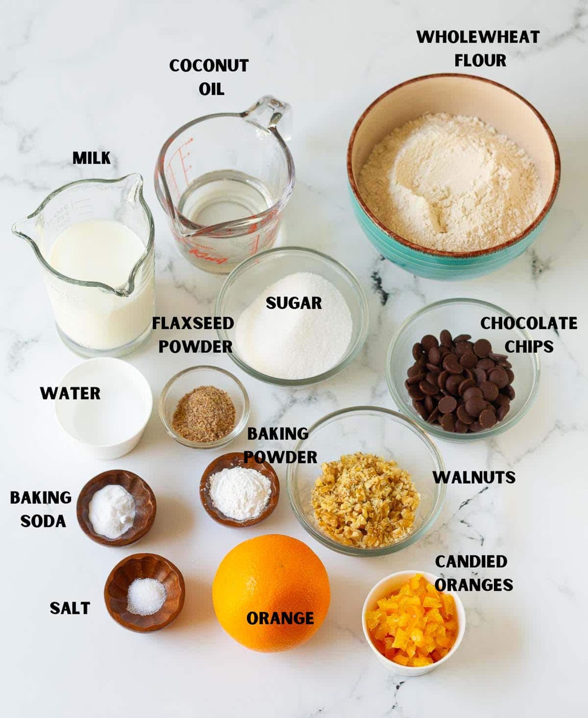 Labelled ingredients for making orange muffins.