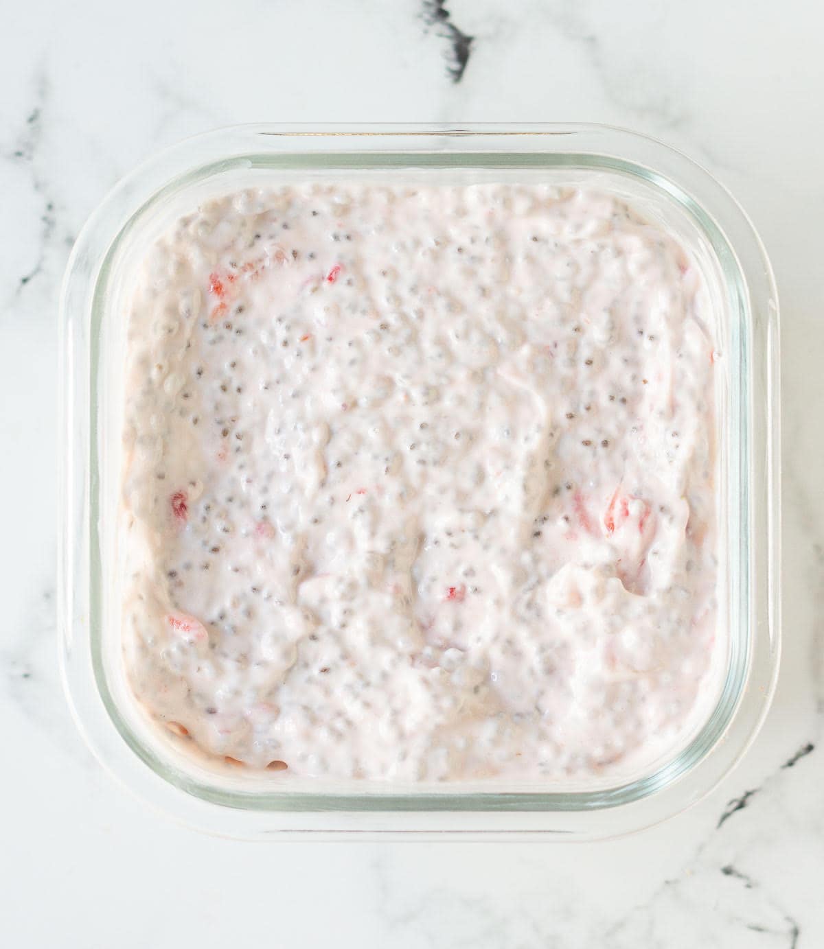 ready chia pudding in a square glass dish.