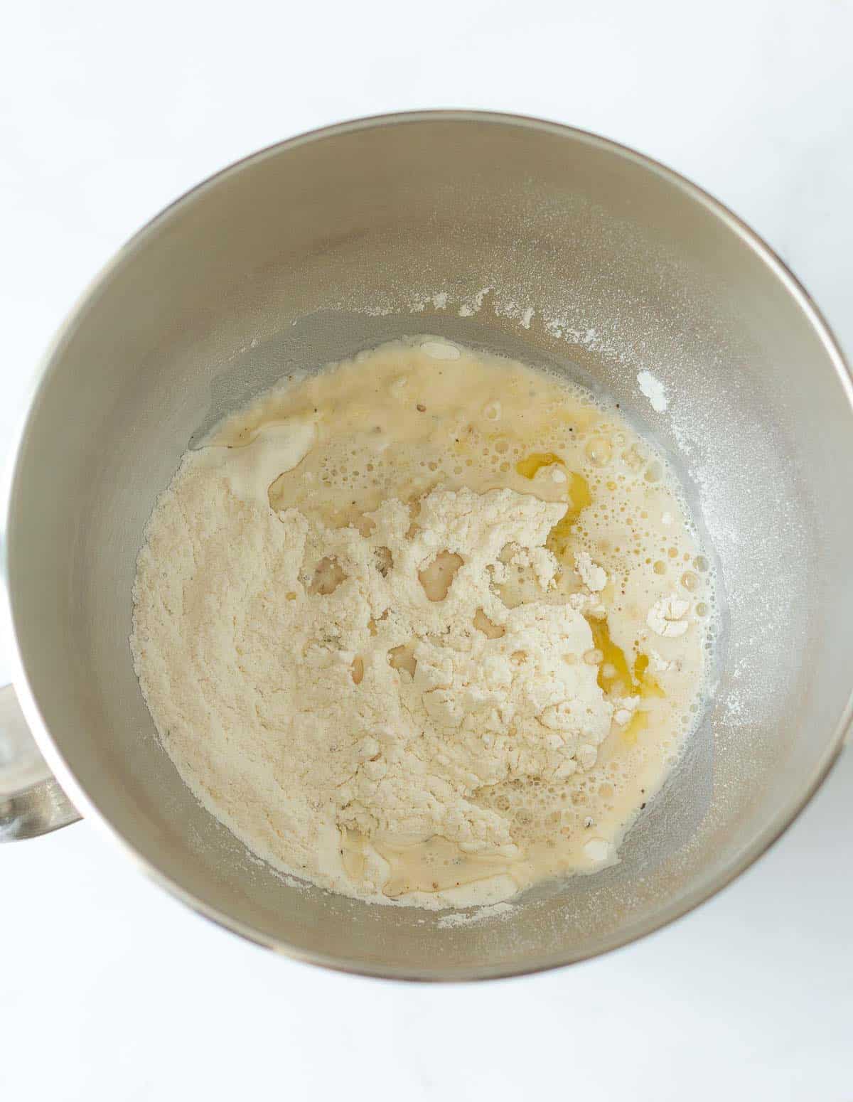 Flour, oil, yeast mixture in a bowl.