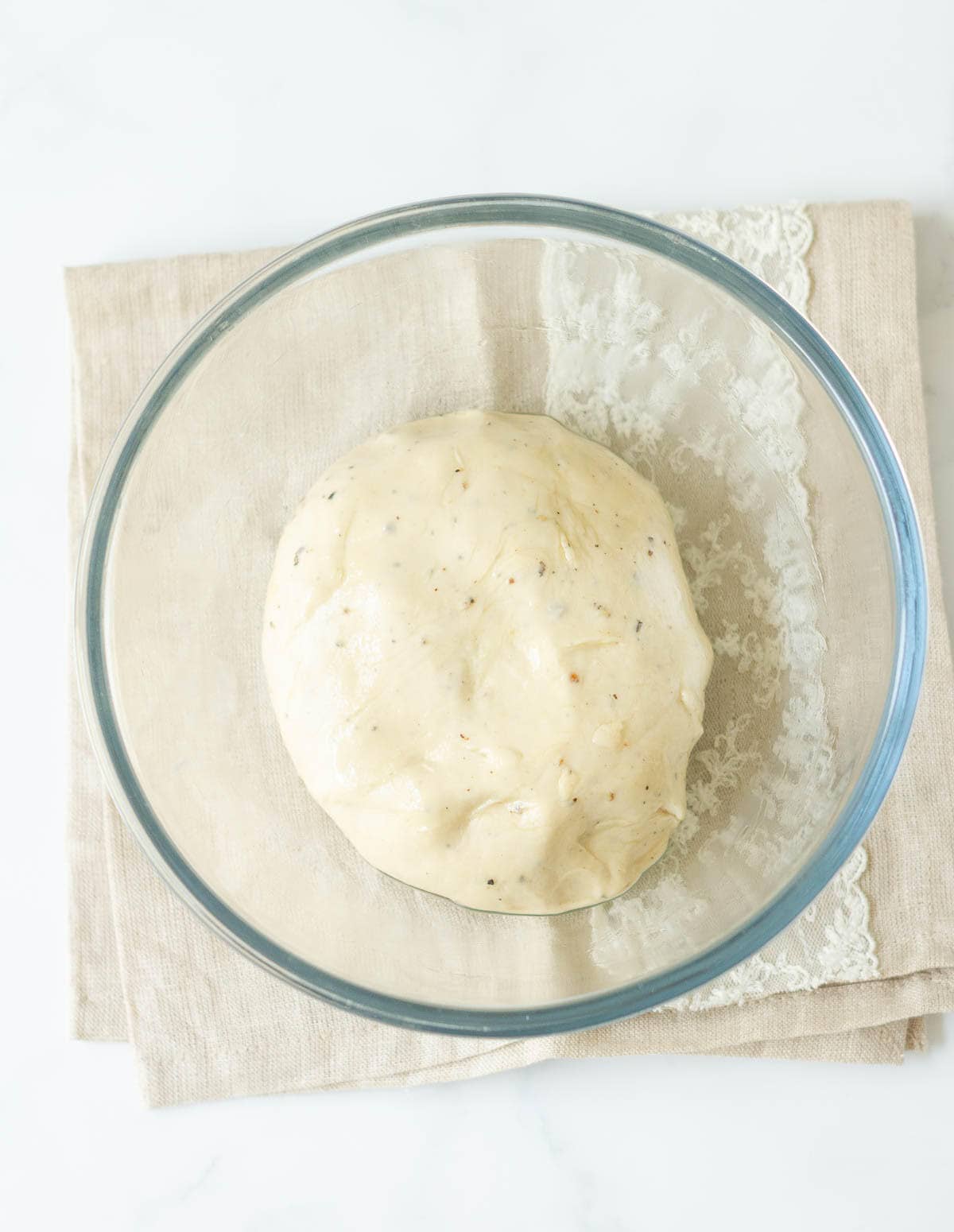 Kneaded bread dough in a bowl.
