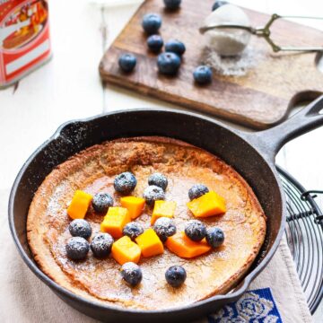 Dutch Baby pancake in a cast iron skillet.