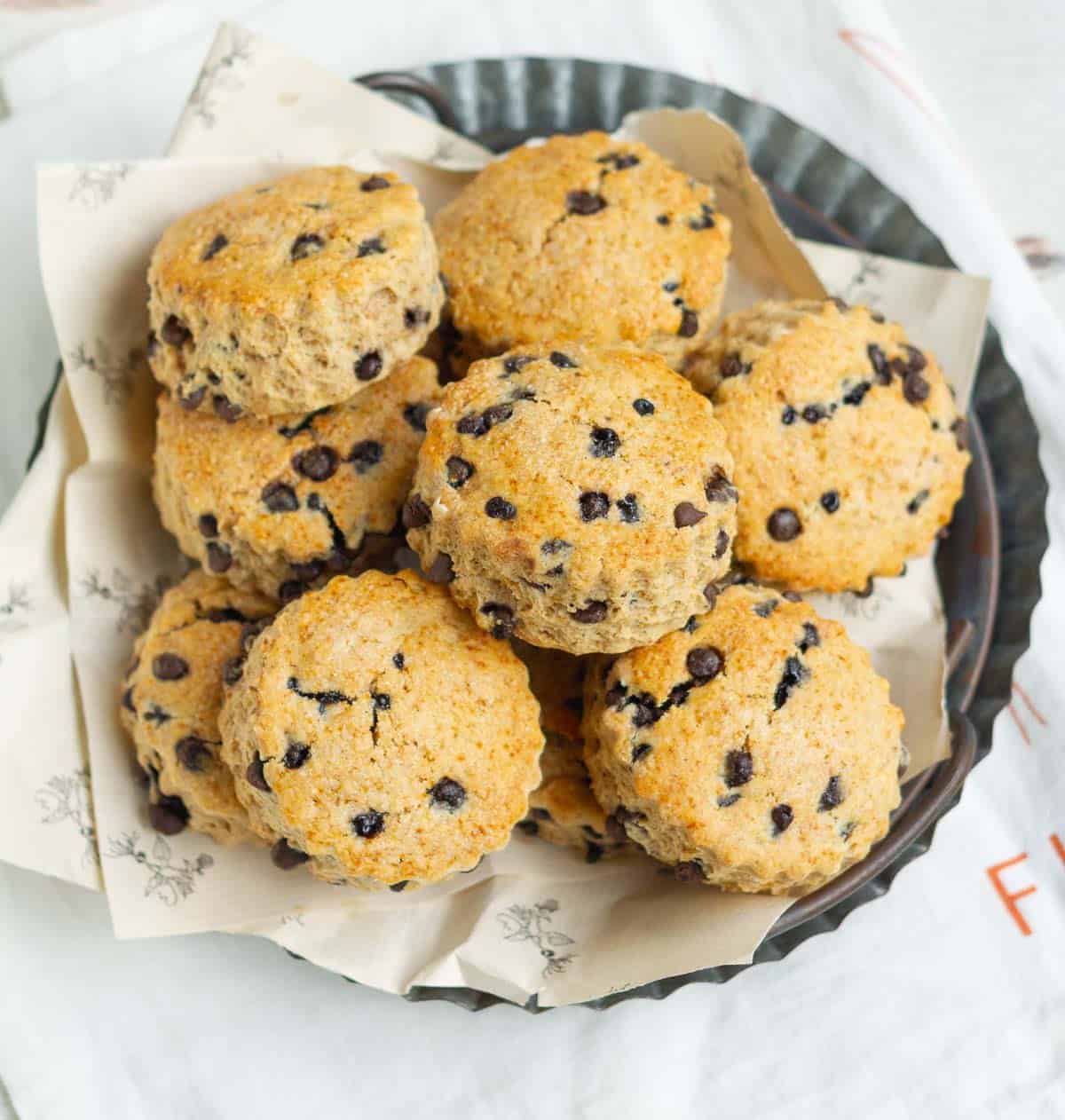 Cinnamon scones with chocolate chips on a tray.