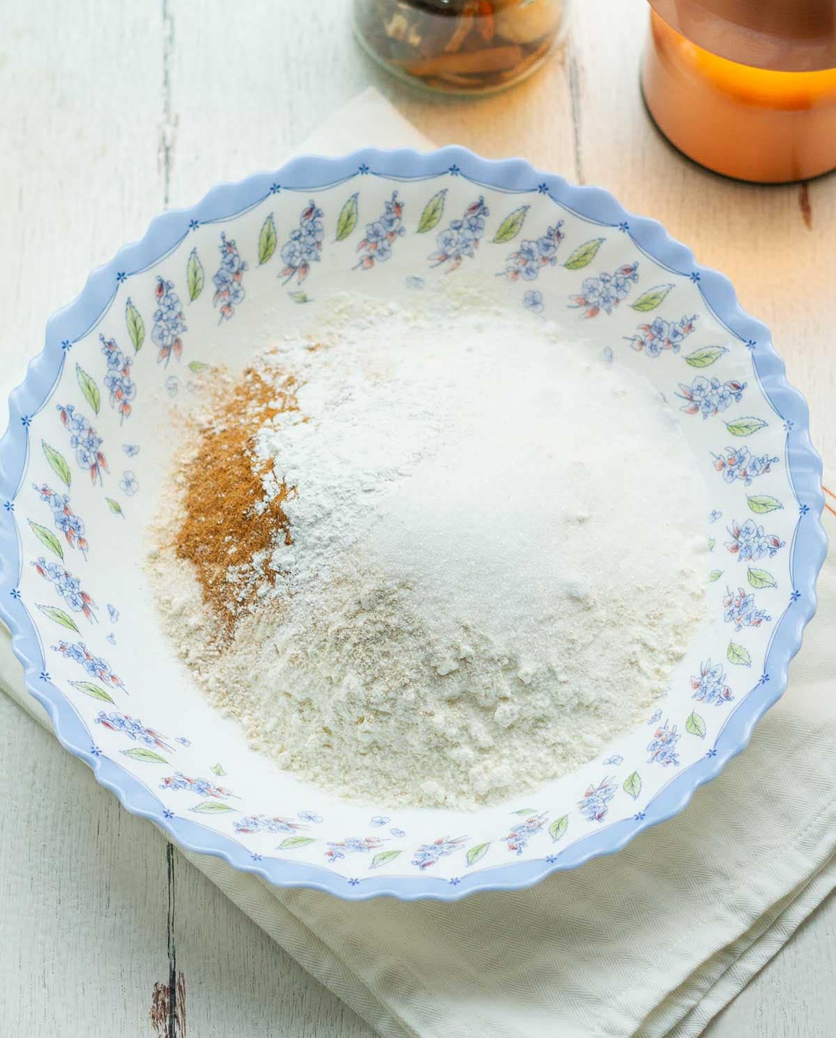 Dry ingredients for making scones in a blue bowl.