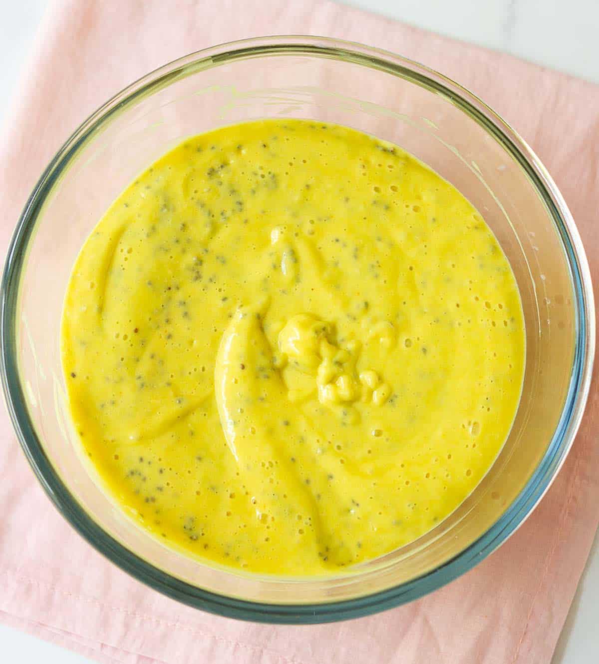 Coconut mango chia pudding in a mixing bowl.