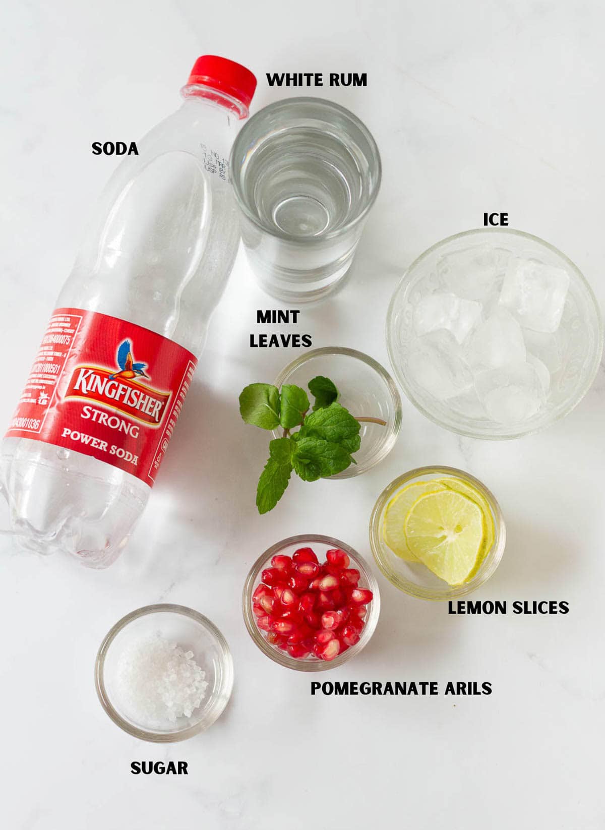 Ingredients for making pomegranate mojito.